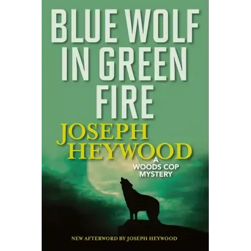 Blue Wolf In Green Fire: A Woods Cop Mystery - Paperback
